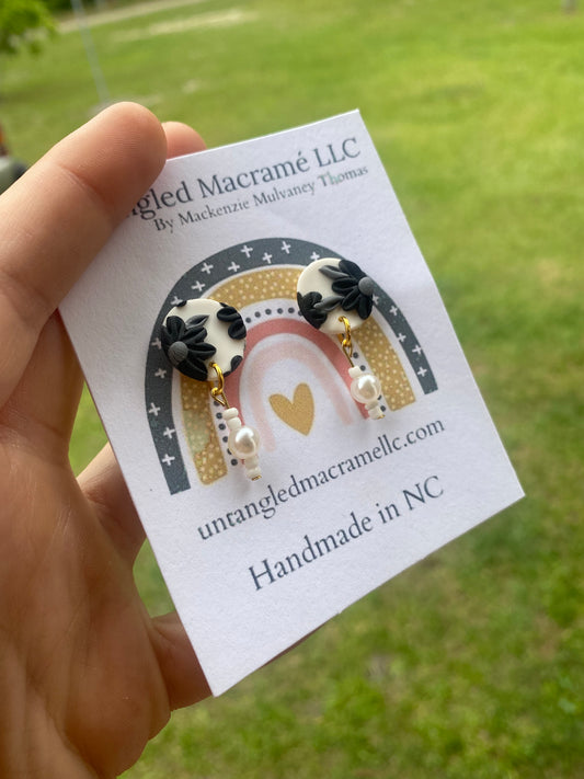 Black floral stud earrings