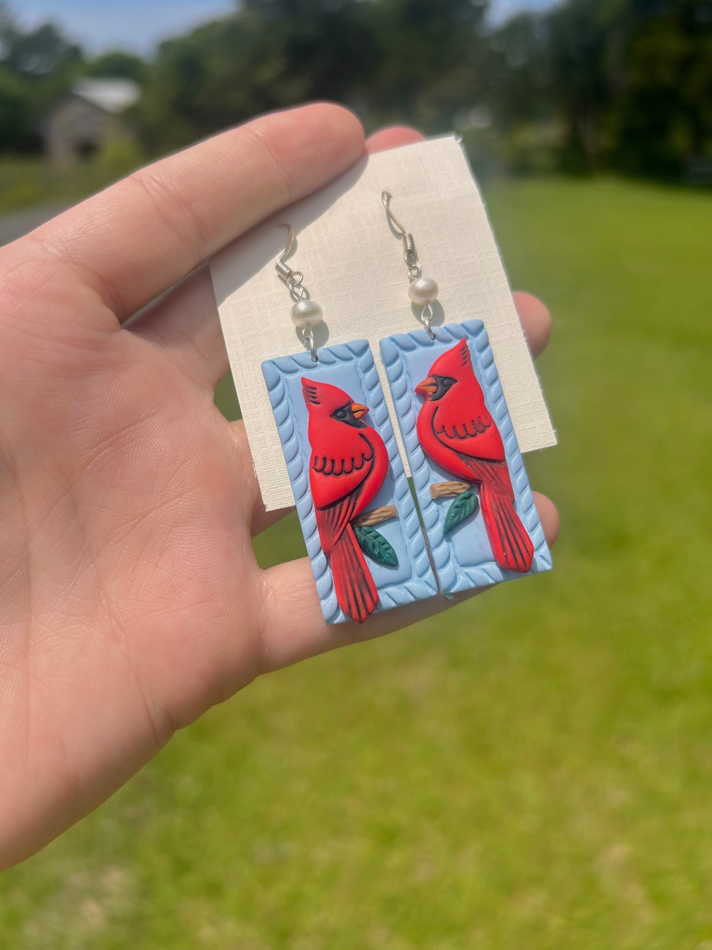 Detailed Cardinal earrings