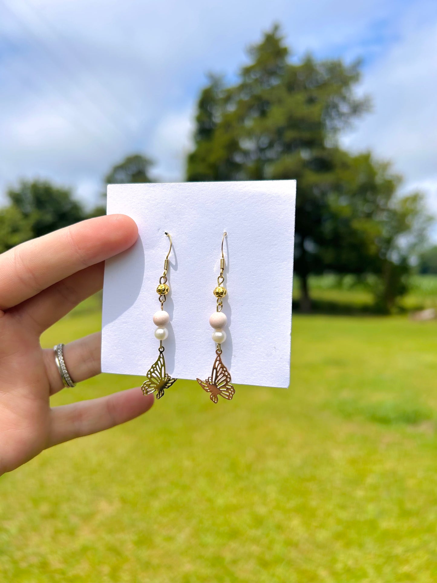 Pink butterfly dangle earrings